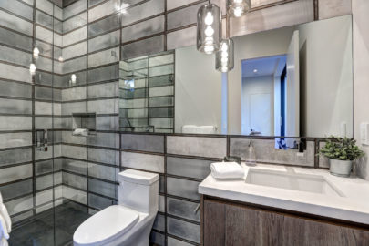 sleek bathroom with grey tiles