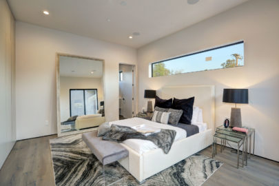 modern bedroom with large mirror